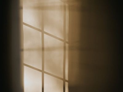 Morning light through abstract window frame geometry